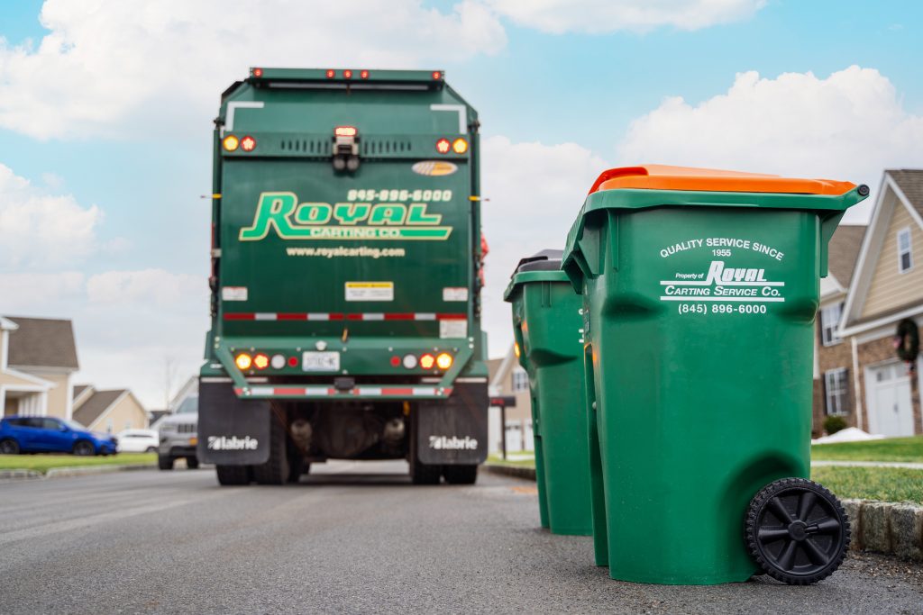 Royal carting garbage cans placed on side of residential street