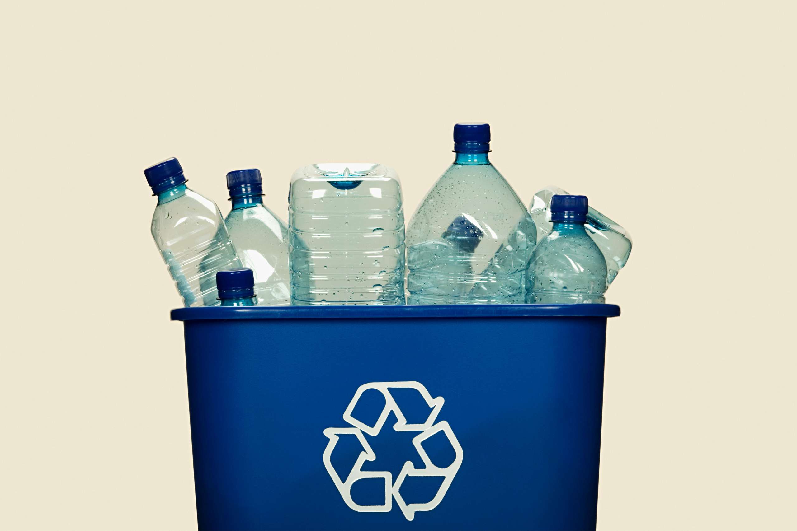 Blue Recycling Bin with plastic bottles