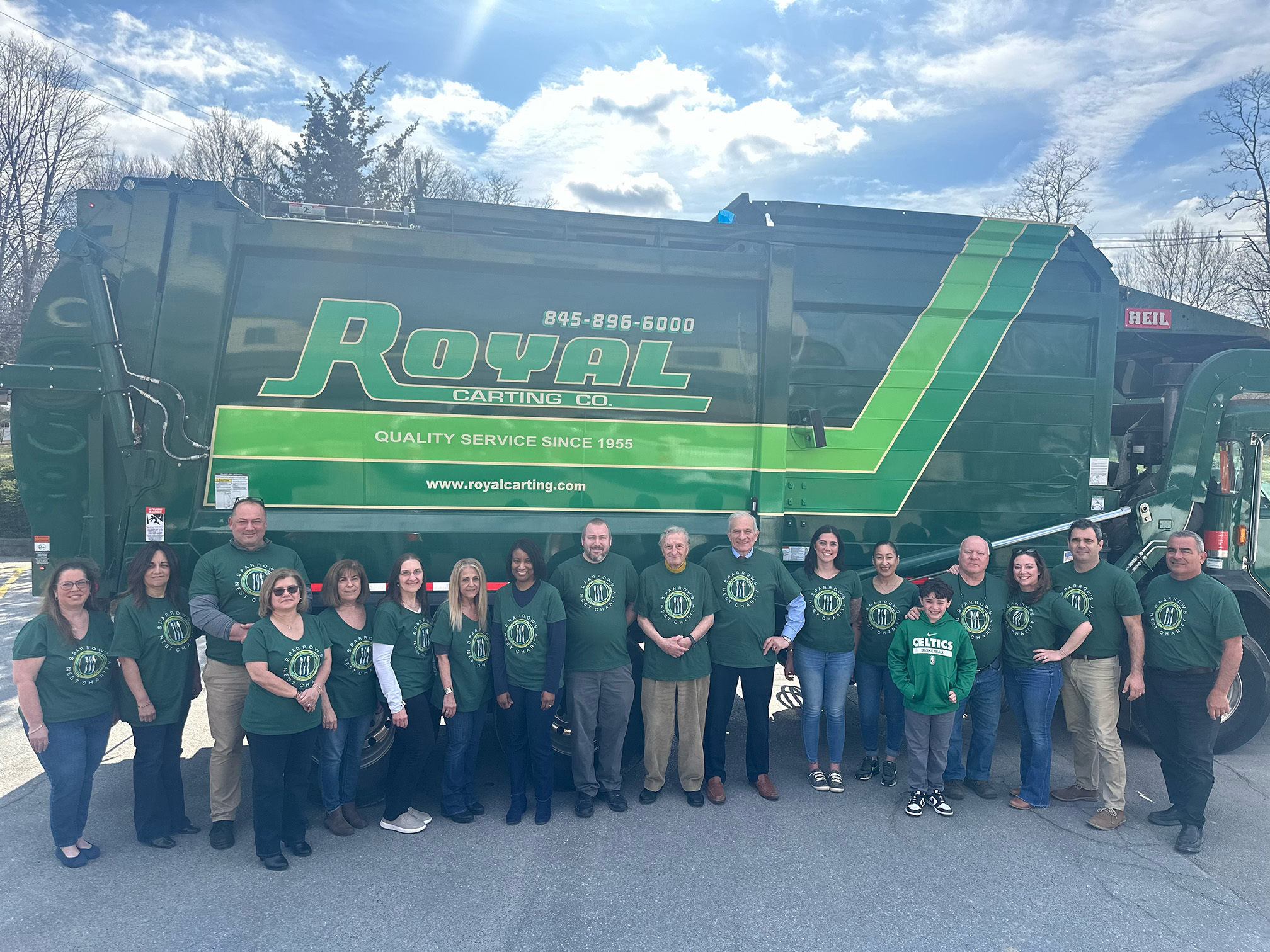 Royal employees and family in front of a truck